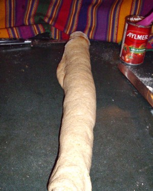 Once the pizza twist bread is rolled tightly it is ready to cut.