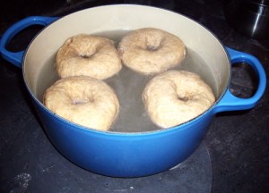 Put bagels in a pan of just boiling water and boil for 1 minute on each side before draining.