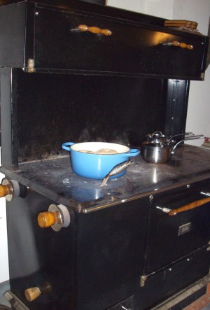 Winter cooking on the Pioneer Maid Woodstove.  Boiling Wholewheat bagels, prior to baking.