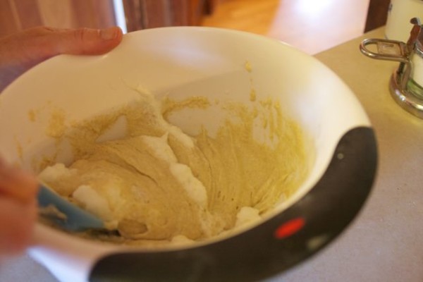 Gently folding the egg white into the batter.